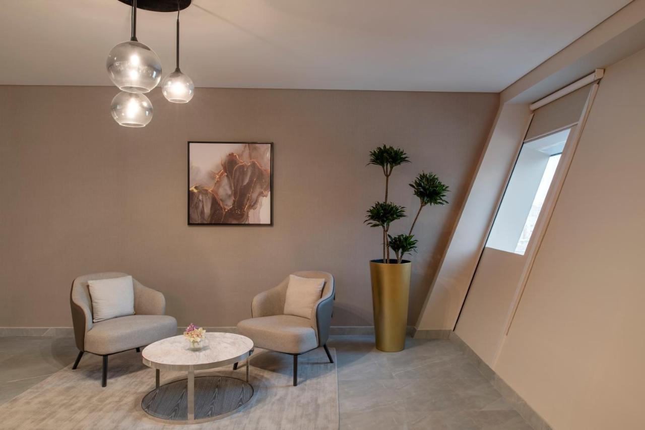 Steigenberger Residence Doha Bagian luar foto A staged living room